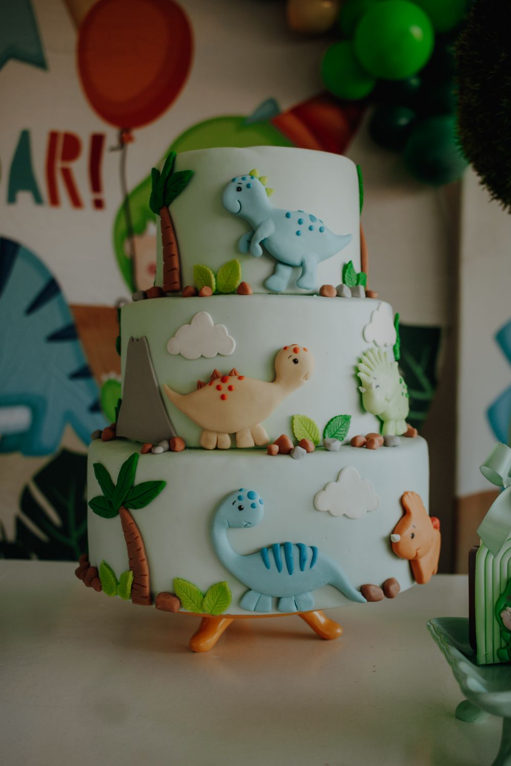 Three-tier dinosaur birthday cake